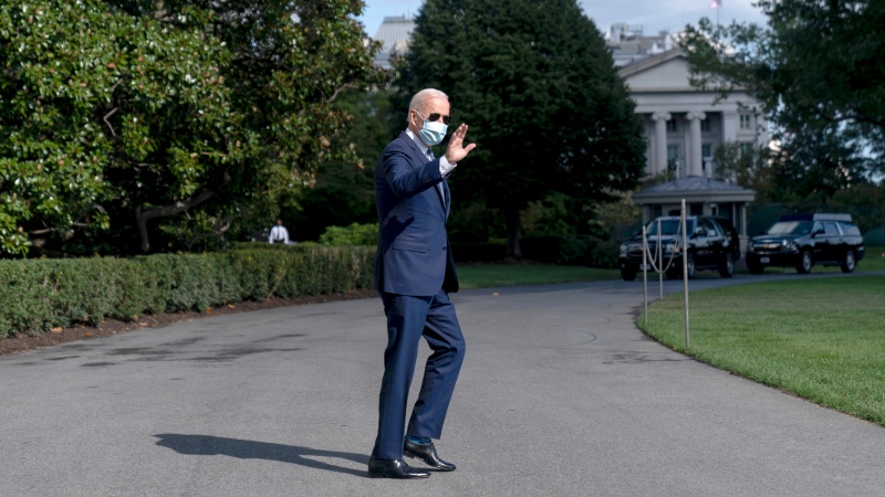 U.S. President Joe Biden waves as he walks towards Marine One on the South Lawn of the White House in Washington, Monday, Sept. 20, 2021, for a short trip to Andrews Air Force Base, Md., and then on to New York ahead of a United Nations General Assembly meeting. (AP Photo/Andrew Harnik) 