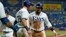 Tampa Bay Rays' Yandy Diaz celebrates his three-run home run off Toronto Blue Jays starting pitcher Robbie Ray with Kevin Kiermaier (39) during the fifth inning of a baseball game Monday, Sept. 20, 2021, in St. Petersburg, Fla. (AP Photo/Chris O'Meara)