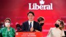 Prime Minister Justin Trudeau is joined on stage by wife Sophie Gregoire, left, and children Xavier and Ella-Grace, right, during his victory speech at Party campaign headquarters in Montreal, early Tuesday, Sept. 21, 2021. THE CANADIAN PRESS/Sean Kilpatrick 