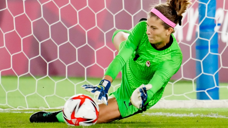 Canada's Stephanie Labbe makes a save against Sweden in the sixth round of the penalty shoot-out in the women's soccer final during the summer Tokyo Olympics in Yokohama, Japan on Friday, August 6, 2021. THE CANADIAN PRESS/Frank Gunn 