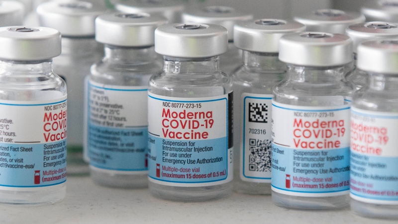 Empty Moderna vaccine vials are shown before a COVID-19 vaccine drive-thru clinic at Richardson stadium in Kingston, Ont., on Friday, Jul. 2, 2021. THE CANADIAN PRESS/Lars Hagberg 