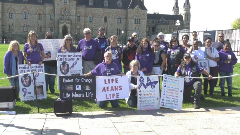 Advocates for victims of violent crime hold a rally on Parliament Hill on the National Day of Remembrance for Murder Victims. (Shaun Vardon/CTV News Ottawa)