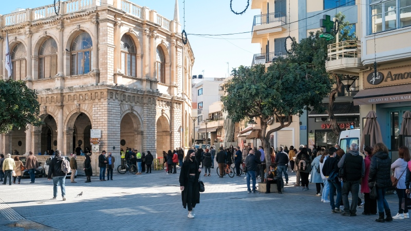 People queue outside the town hall in Chania, on the Greek island of Crete, Wednesday, Feb. 24, 2021. (AP Photo/Harry Nakos)
