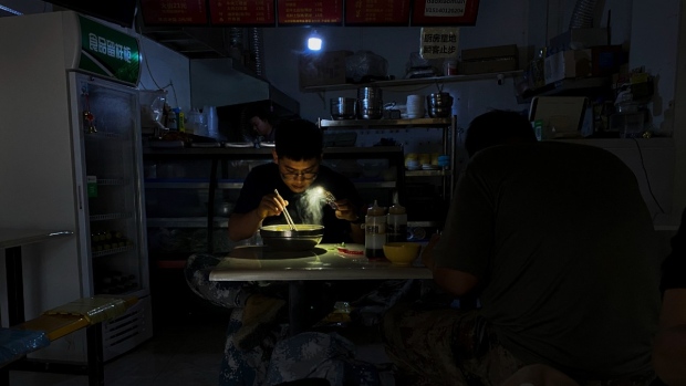 Chinese switch to flashlights, generators amid power cuts