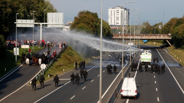 Slovenia police use water cannons at anti-COVID-19 pass protest