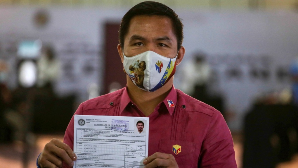 Manny Pacquiao shows his certificate of candidacy