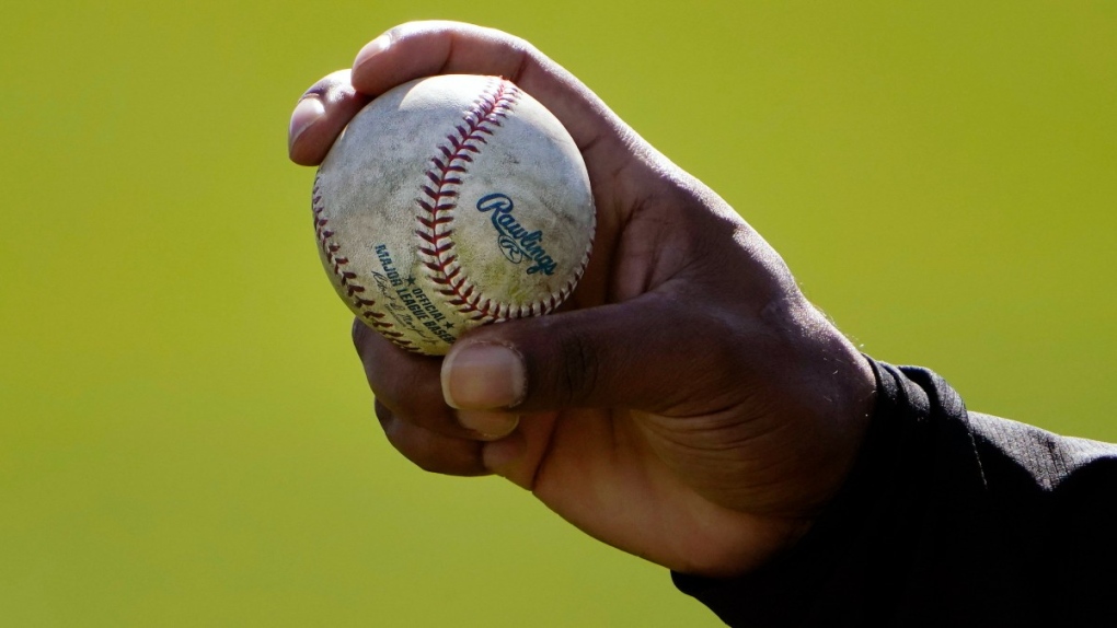 A pitcher shows his grip