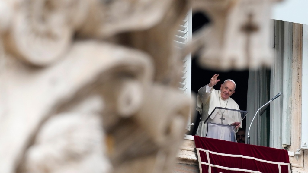 Pope Francis waves at St.Peter's Square