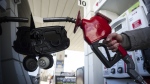 A woman fills up her with gas in Toronto, on Monday April 1, 2019. THE CANADIAN PRESS/Christopher Katsarov 