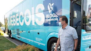 Bloc Quebecois Leader Yves-Francois Blanchet pulls his mask off as he arrives to a news conference Monday, August 23, 2021 in Trois Rivieres, Quebec. THE CANADIAN PRESS/Jacques Boissinot