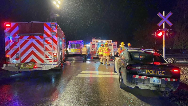 Emergency crews on scene of a crash between a car and a train in New Tecumseth on Thursday, October 14, 2021 (Tristan Phillips/CP24)