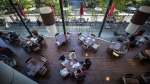 People dine at a restaurant in Vancouver, on Tuesday, September 21, 2021. (THE CANADIAN PRESS / Darryl Dyck)