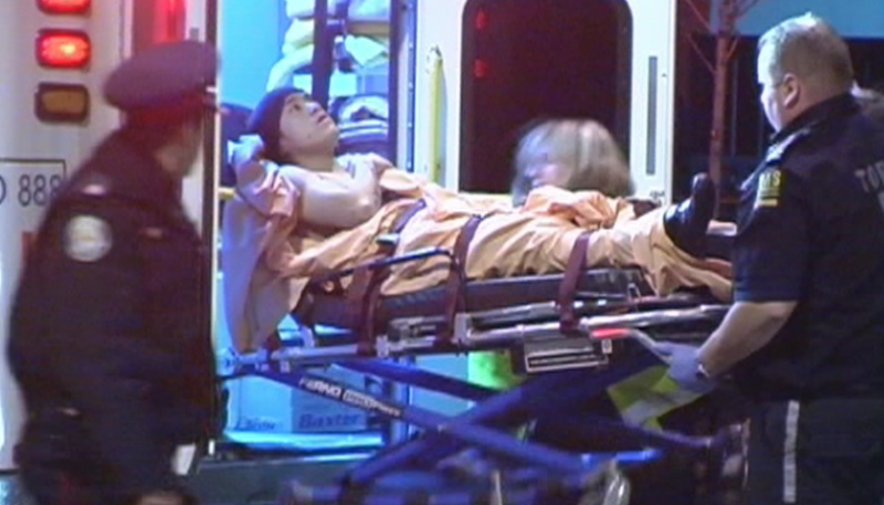 Toronto EMS transport the victim after he was shot on a TTC bus on Arleta Avenue as it approached Sheppard Avenue, east of Jane Street, late Thursday, Nov. 26, 2009.