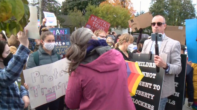 Dozens gathered to protest an anti-trans activist outside a west Ottawa school on Tuesday morning. (CTV Morning Live)