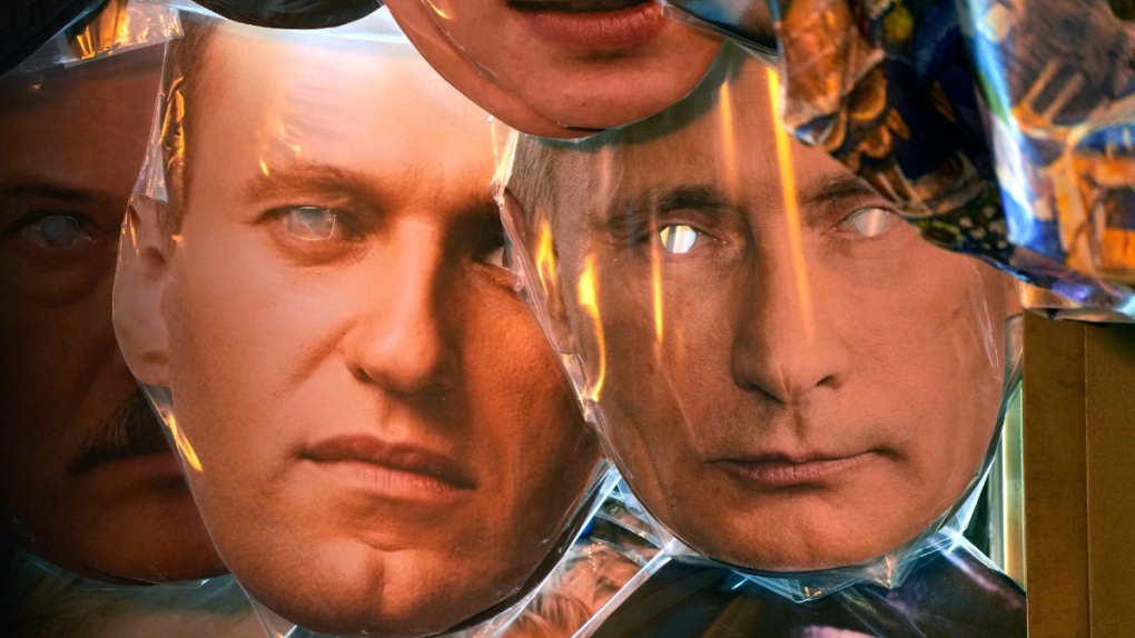 Masks depicting Putin and Navalny
