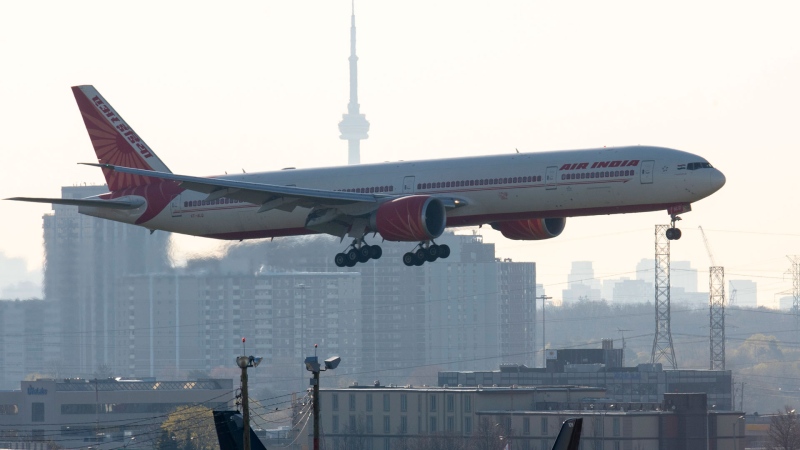 Air India flight 187 from New Delhi lands at Pearson Airport in Toronto on Friday, April 23, 2021. The flight was the last landing allowed after all flights from India and Pakistan to Canada were suspended. THE CANADIAN PRESS/Frank Gunn 
