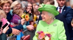 Queen Elizabeth II is greeted by crowds of people during a visit with Meghan, Duchess of Sussex to Chester, north west England, Thursday, June 14, 2018. (Eddie Mulholland/Pool Photo via AP) 