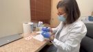 Heidi Gabriel preparing a flu shot in her pharmacy, Gabriel Drugs. (Dave Charbonneau/CTV News Ottawa)