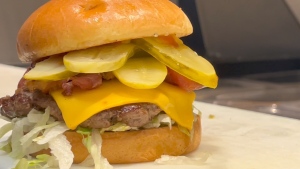 A hamburger from World Burger in Ottawa loaded with extra pickles. (Dave Charbonneau/CTV News Ottawa)