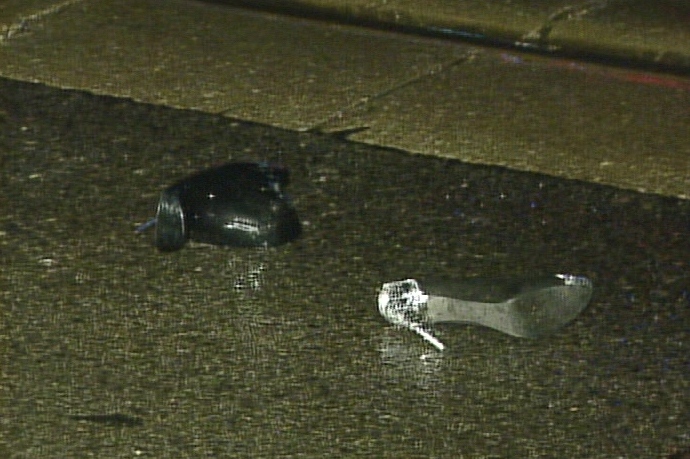 Shoes lie on the ground after two people were struck by a car in the Kingston Road and Elmer Avenue area early Monday, Nov. 30, 2009.