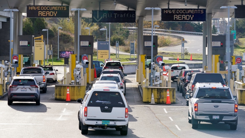 Cars line up to enter the U.S. from Canada at the Peace Arch border crossing Monday, Nov. 8, 2021, in Blaine, Wash. (AP / Elaine Thompson) 