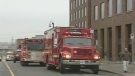 Fire officials evacuate a government complex on Eddy Street in Gatineau, Tuesday, Dec. 1, 2009.