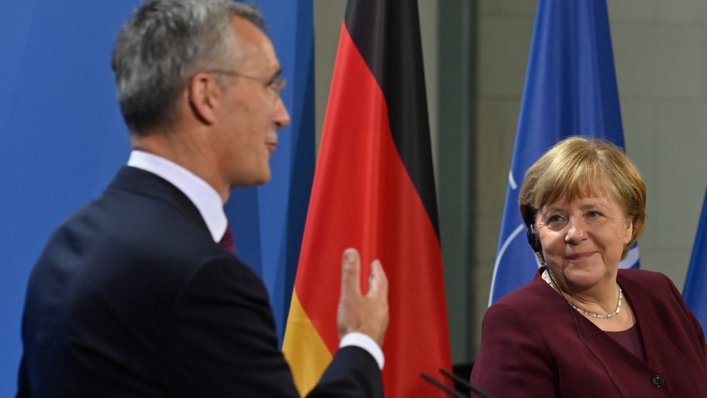 Angela Merkel, right, and Jens Stoltenberg