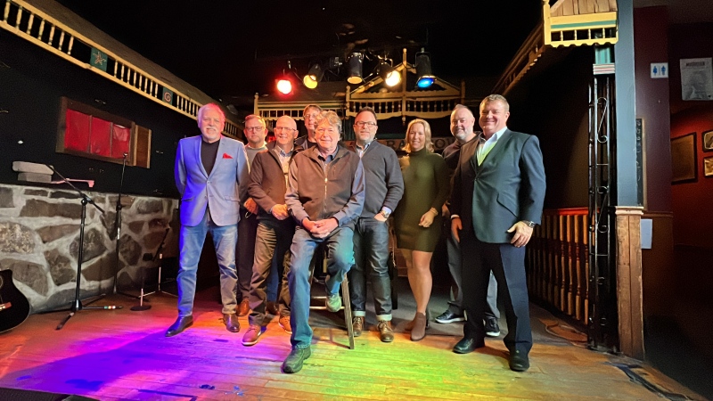 Rainbow Bistro owner Danny Sivyer, centre, sits with many of the corporate sponsors who raised $50,000 in order for the long-standing storied concert hall to remain open. Ottawa, Ont. Nov. 22, 2021. (Tyler Fleming / CTV News Ottawa)