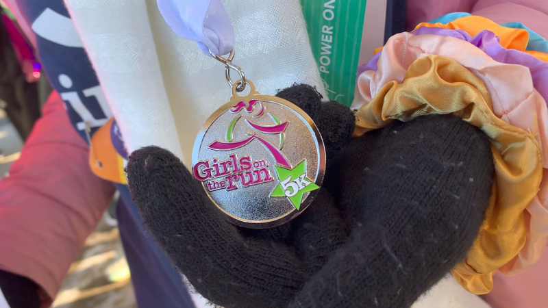 A medal given to participants of Girls on the Run Ottawa's 5k run in Ottawa on Saturday, Nov. 27, 2021. (Jackie Perez/CTV News Ottawa)