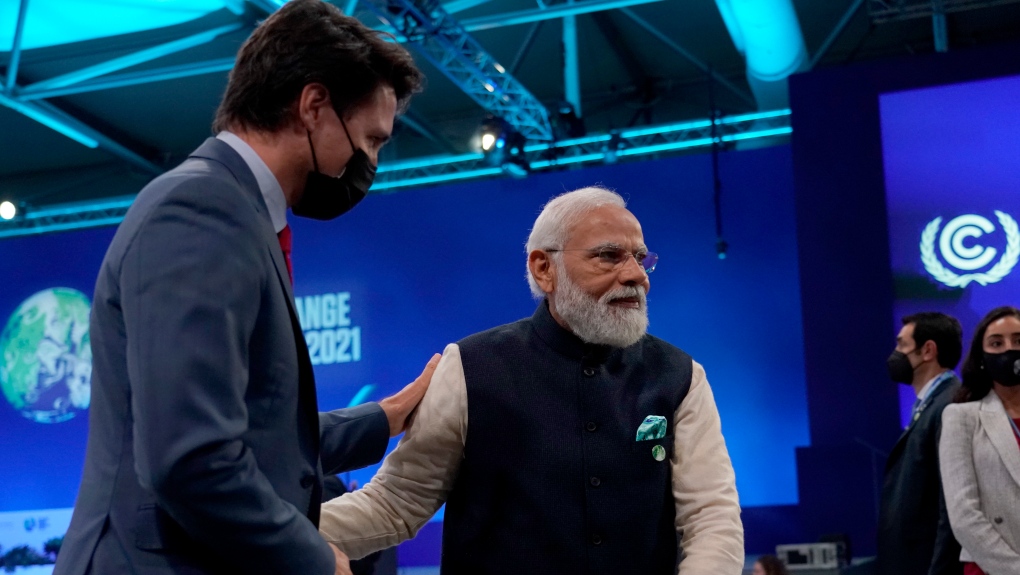Narendra Modi speaks with Justin Trudeau