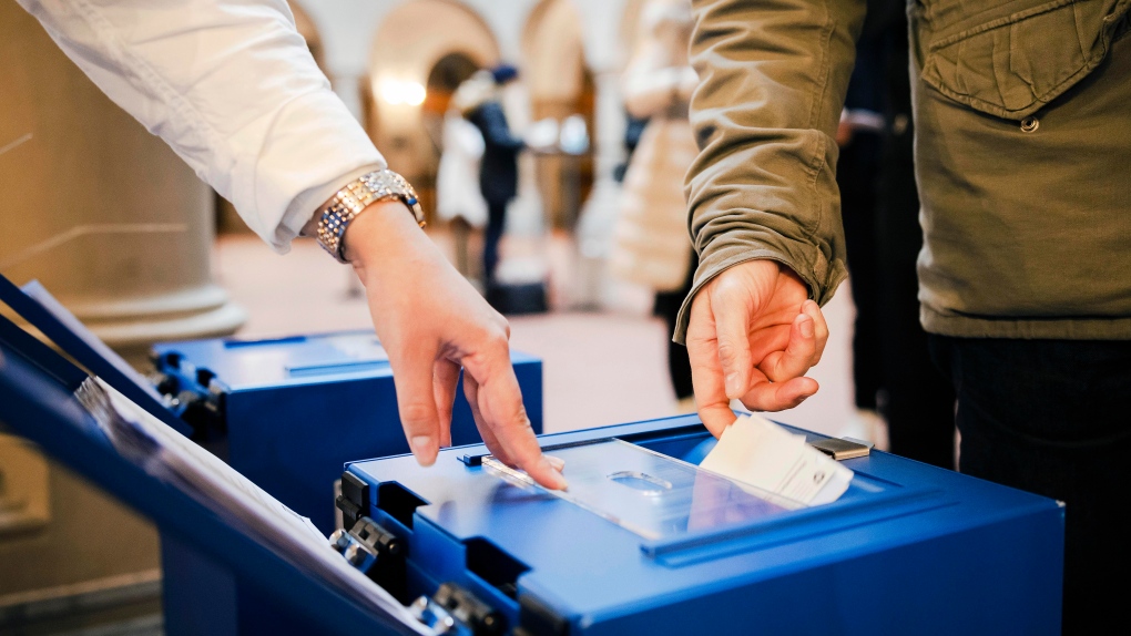 Swiss voters cast ballots for COVID-19 law