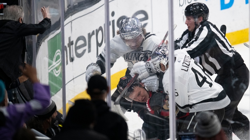 Ottawa Senators left wing Brady Tkachuk (7) gets into a brawl with Los Angeles Kings left wing Brendan Lemieux (48) and center Blake Lizotte (46) in the third period of an NHL hockey game Saturday, Nov. 27, 2021, in Los Angeles. (AP Photo/Kyusung Gong) 