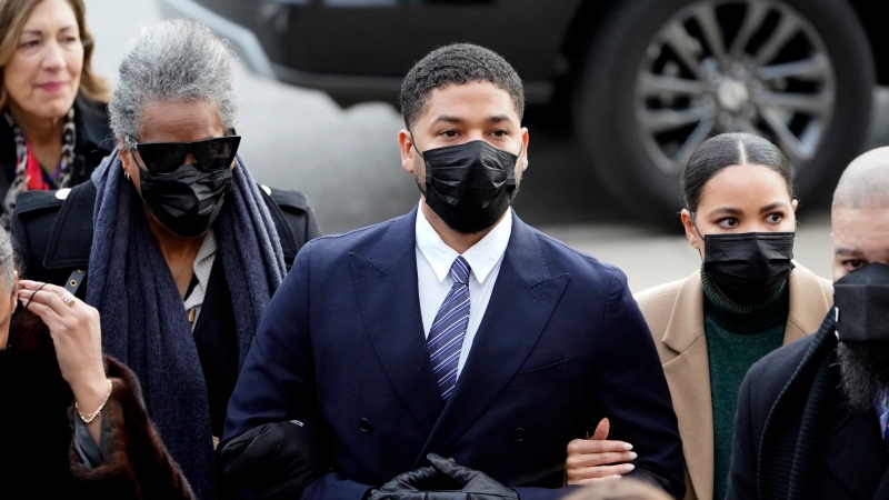 Actor Jussie Smollett walks with family members as they arrive Monday, Nov. 29, 2021, at the Leighton Criminal Courthouse for jury selection at his trial in Chicago. (AP Photo/Charles Rex Arbogast) 
