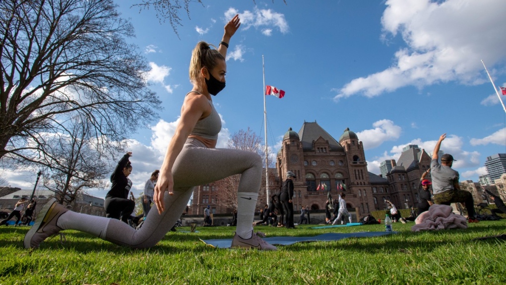 Working out on the lawn of Queen's Park in Toronto