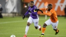 Pacific FC midfielder Jamar Dixon (22) battles for a ball with Forge FC defender Dominic Samuel (4) during Canadian Premier League championship game action at Tim Hortons Field in Hamilton, Ont., Sunday, Dec. 5, 2021. THE CANADIAN PRESS/NICK IWANYSHYN