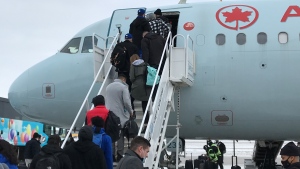 The Winnipeg Blue Bombers prepare to leave Winnipeg for Hamilton, Ontario, on Dec. 7, 2021, in advance of the 2021 Grey Cup final against the Hamilton Tiger-Cats. (Source: Joey Slattery/CTV News Winnipeg)