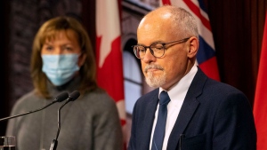 Ontario Chief Medical Officer Dr. Kieran Moore and Health Minister Christine Elliott attend a press briefing at the Ontario Legislature in Toronto, Friday, Dec. 10, 2021. THE CANADIAN PRESS/Chris Young 
