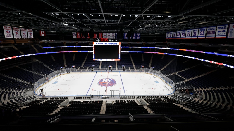 The new UBS Arena sits empty before the first New York Islanders NHL hockey game against the Calgary Flames, Saturday, Nov. 20, 2021, in Elmont, N.Y. (AP Photo/Adam Hunger) 