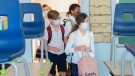 Students wear face masks as they attend class on the first day of school in Montreal, Tuesday, August 31, 2021, as the COVID-19 pandemic continues in Canada and around the world. THE CANADIAN PRESS/Graham Hughes