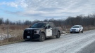 An OPP vehicle sits on Crooked Road southeast of Oil Springs, Ont. amid a homicide investigation on Thursday, Dec. 30, 2021. (Bryan Bicknell / CTV News)