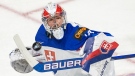 Slovakia goalie Simon Latkoczy (30) makes a save against the United States during first period IIHF World Junior Hockey Championship action in Red Deer, Alberta on Sunday, December 26, 2021. THE CANADIAN PRESS/Jonathan Hayward