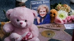 Flowers, stuffed toys and cards are displayed at the Hollywood Walk of Fame star of the late Betty White on Dec. 31, 2021, in Los Angeles. (AP Photo/Ringo H.W. Chiu)