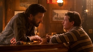 This image released by Amazon shows Ben Affleck, left, and Tye Sheridan in a scene from "The Tender Bar." (Claire Folger/Amazon via AP) 
