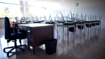 A empty teacher's desk is pictured in an empty classroom at Mcgee Secondary school in Vancouver on Sept. 5, 2014. THE CANADIAN PRESS/Jonathan Hayward 