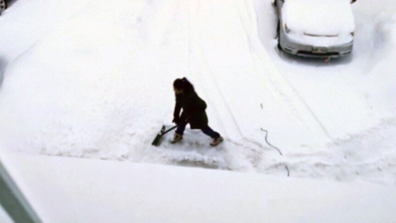 Minister criticized for tweet of wife shovelling 