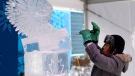 Ice carver Icha Setiawan of Indonesia works on an ice sculpture at Commissioner's Park on the first weekend of the National Capital Commission's Winterlude Festival in Ottawa, Saturday, Jan. 30, 2016. (THE CANADIAN PRESS/Justin Tang)