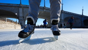 Skaters brave the cold to lace up the blades on opening day of the Rideau Canal Skateway in Ottawa on Friday, Jan. 14, 2022. For the first time in 20 years 100% of the canal opened on the first day. (Sean Kilpatrick/THE CANADIAN PRESS)