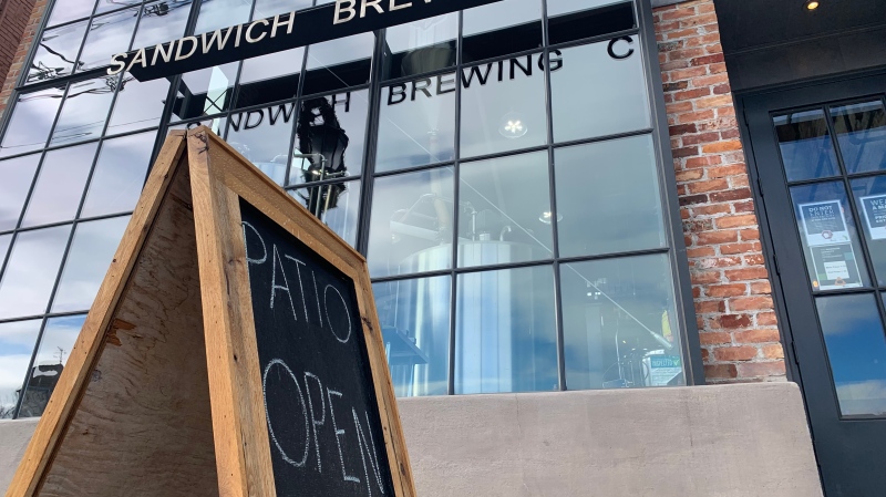 A ‘patio open’ sign sits out front of Sandwich Brew Company in Windsor, Ont. On Jan. 14, 2022. (Rich Garton/CTV Windsor)
