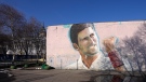 A mural depicting Serbian tennis player Novak Djokovic on a wall in Belgrade, Serbia on Jan. 16, 2022. (AP Photo/Darko Vojinovic)