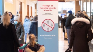 People walk through a shopping mall in Montreal, Saturday, January 15, 2022, as the COVID-19 pandemic continues in Canada. THE CANADIAN PRESS/Graham Hughes 